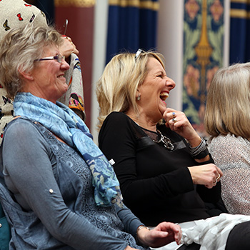 Two members of the audience laughing